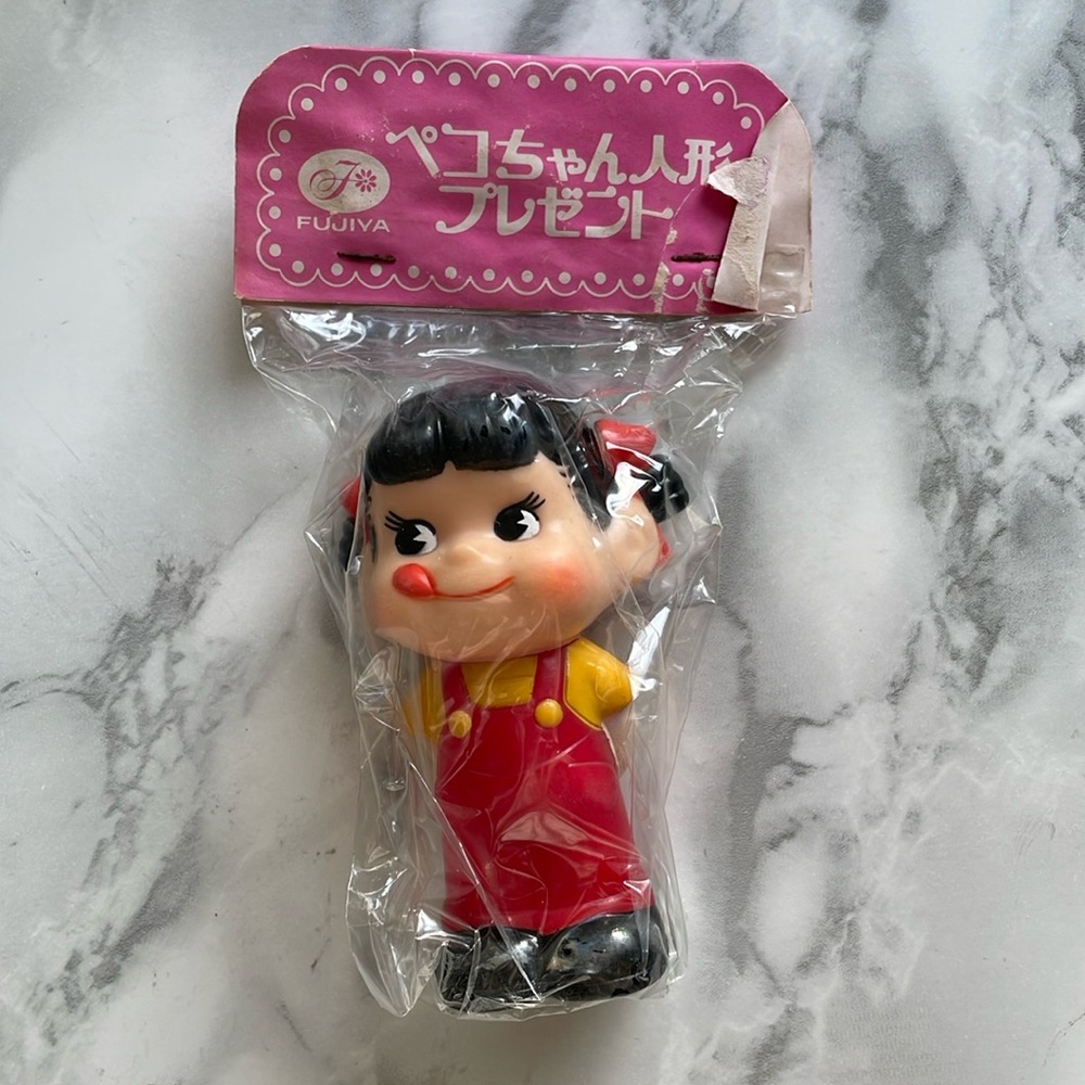 Vintage Peko-chan sofubi squeaker figure. ASIS